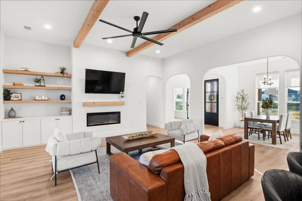 1220 Lynn Way, Waxahachie, TX 75165 Fireplace, built-in cabinetry and arched openings add character and functionality.