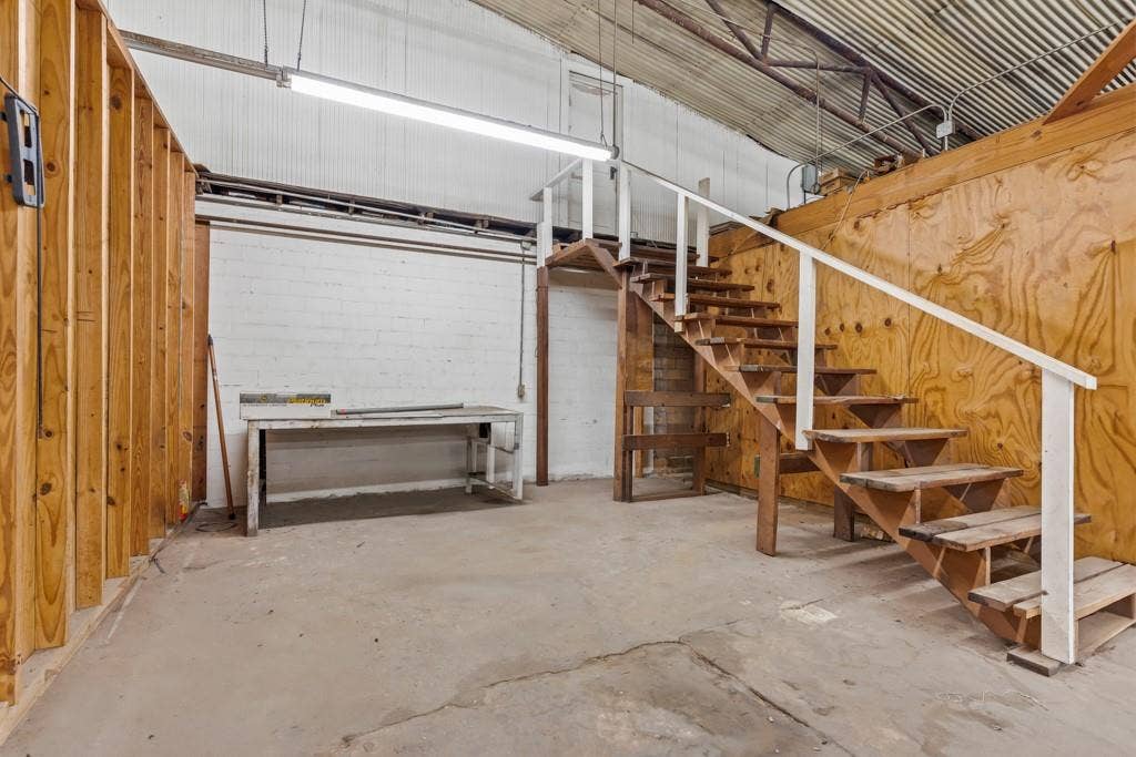 414 E Marshall Street, Gilmer, TX 75644 Open workspace with concrete flooring