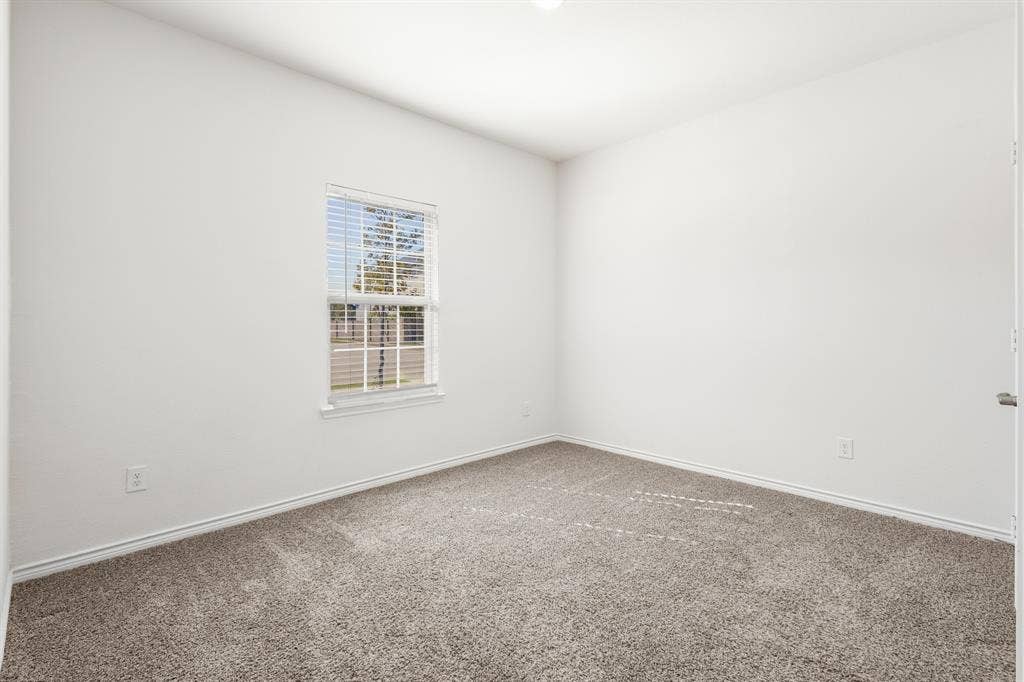1536 Estivella Drive, Little Elm, TX 75068 Carpeted room with white walls, a single window with blinds, and recessed lighting
