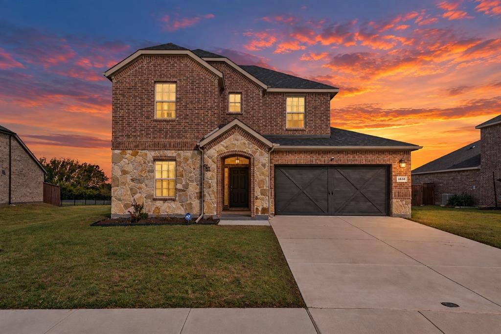 1536 Estivella Drive, Little Elm, TX 75068 Brick and stone exterior with arched entryway