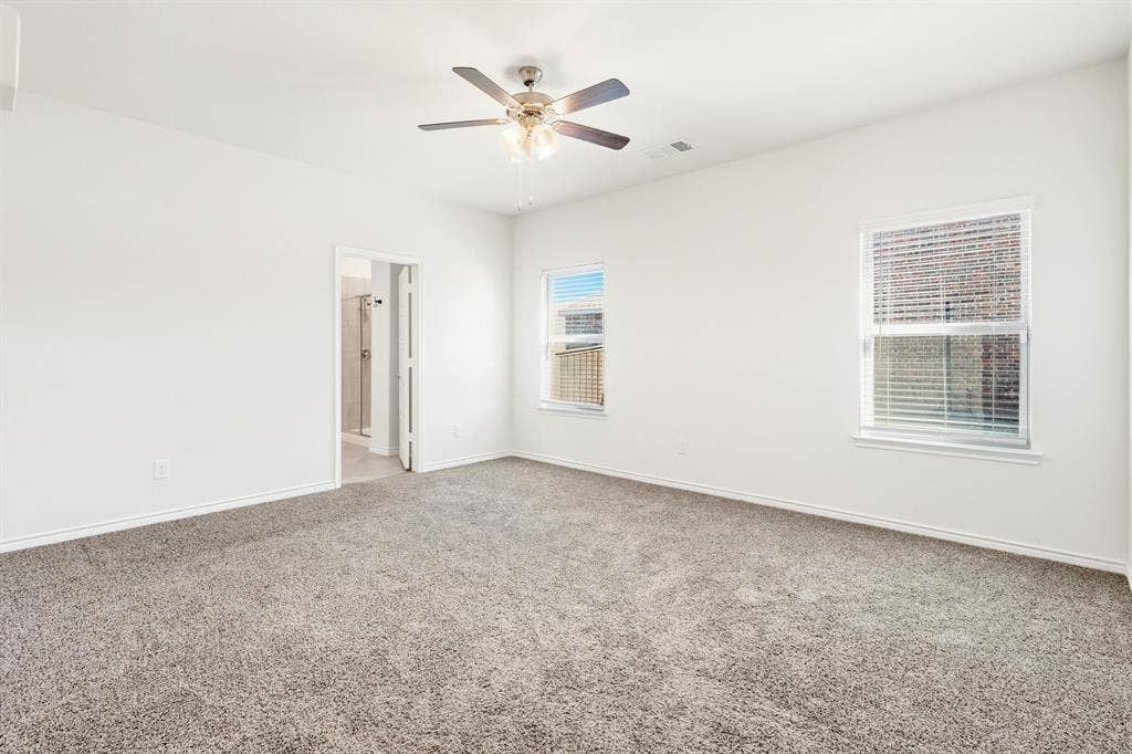 1536 Estivella Drive, Little Elm, TX 75068 White painted walls and gray carpeting