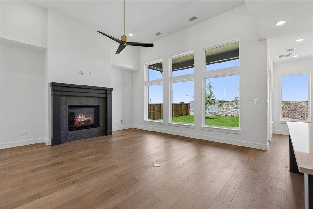 A wall of windows floods this family room with natural light and creates a beautiful view to the private back yard.
