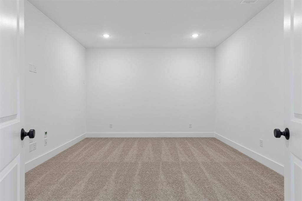 This spacious media room paired with adjacent game room create the ultimate family entertainment zone.
