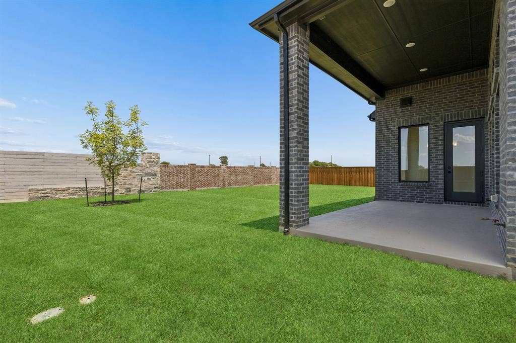 Dining al fresco is in your future on this wonderful covered back patio!