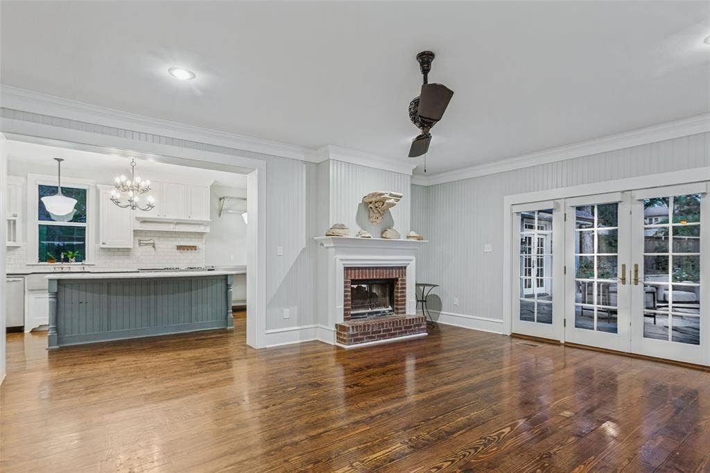 506 W Virginia Street, McKinney, TX 75069 Living Room with view of the kitchen, fireplace, and views into the beautiful backyard