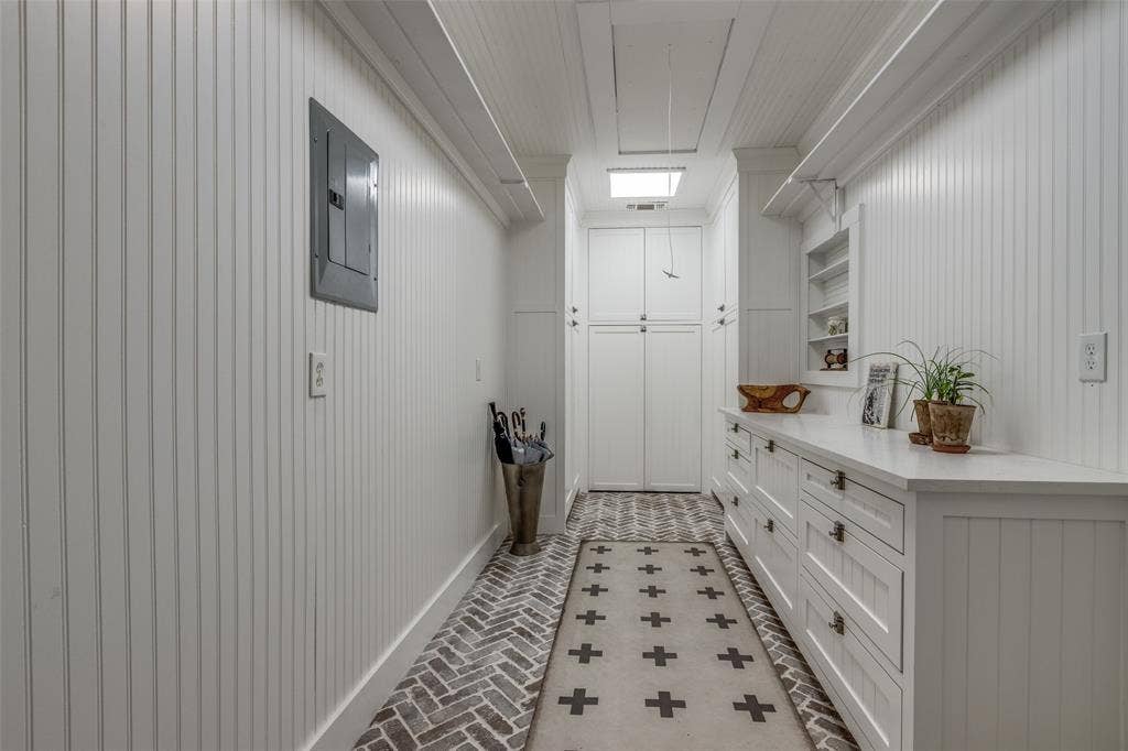 506 W Virginia Street, McKinney, TX 75069 Located off the Utility room and next to the garage, this room contains a large safe, and counter space for a wrapping room, or work space