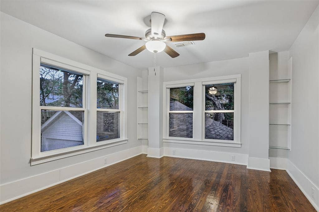 506 W Virginia Street, McKinney, TX 75069 Upstairs bedroom facing backyard with built in shelving and armoire