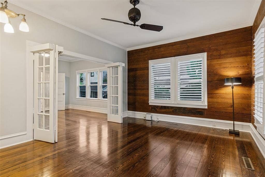 506 W Virginia Street, McKinney, TX 75069 Located in the front room, this office features shiplap from when the house was originally built is 1890, french doors open to bedroom with option to close shades on french doors with automatic shades
