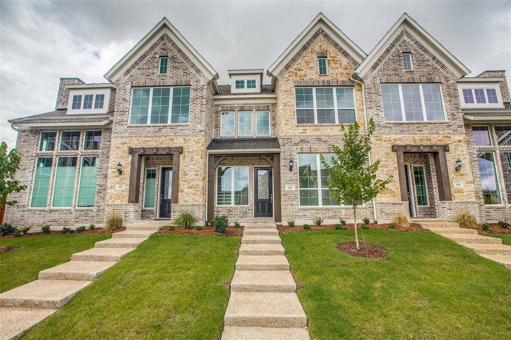 4944 Mckinney Hollow Drive, McKinney, TX 75070 Stone and brick exterior with multiple gabled rooflines, prominent window dormers, and dark-framed entry doors