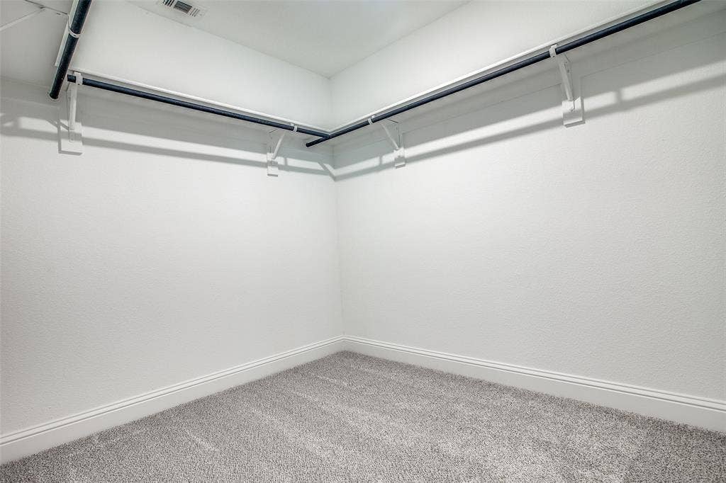 4944 Mckinney Hollow Drive, McKinney, TX 75070 Gray carpeting with white baseboards and white walls