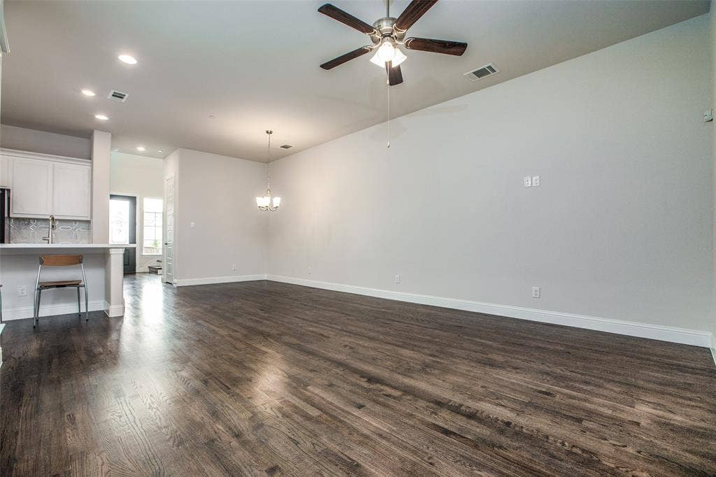 4944 Mckinney Hollow Drive, McKinney, TX 75070 Expansive room featuring wood-finish flooring, a ceiling fan, recessed lighting, and a chandelier