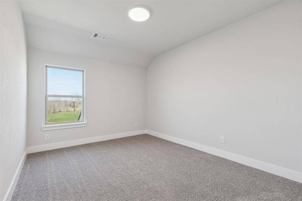410 Rancher Trail, Waxahachie, TX 75165 Carpeted room featuring a single window and a ceiling-mounted light fixture