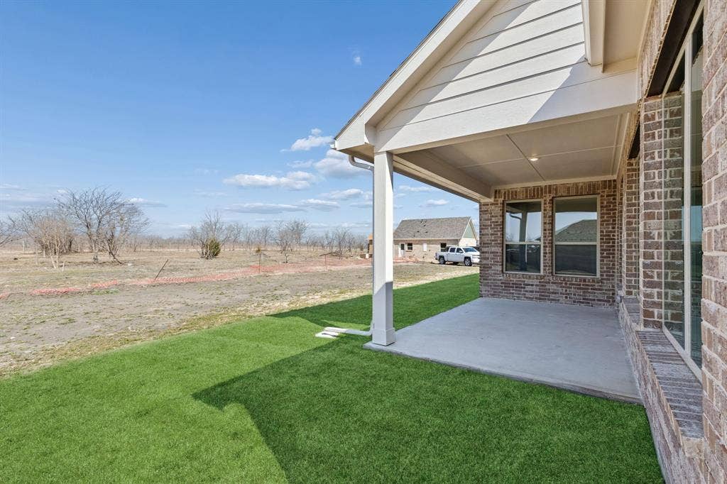 410 Rancher Trail, Waxahachie, TX 75165 Covered patio with a concrete surface