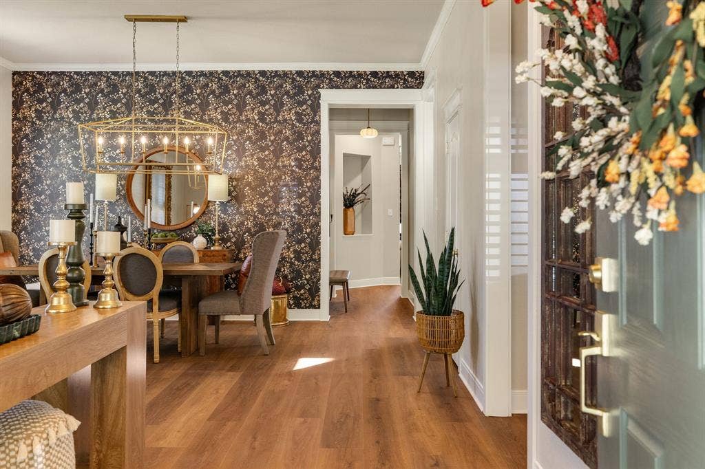 630 Candlewood Trail, Murphy, TX 75094 Wood-finish flooring throughout, decorative accent wall, recessed lighting, and a modern chandelier