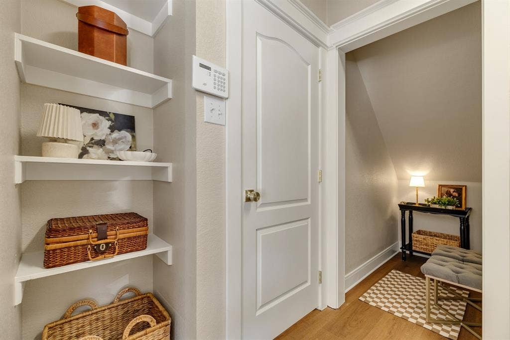 630 Candlewood Trail, Murphy, TX 75094 Built-in shelving, panel door, wood-finish flooring, and crown molding