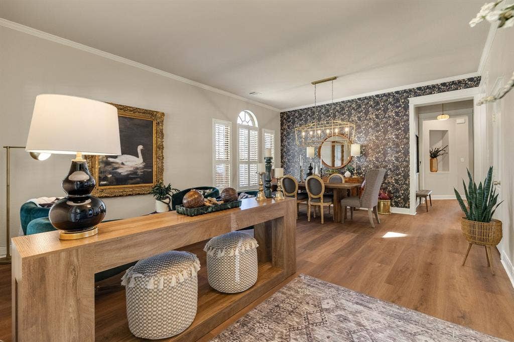 630 Candlewood Trail, Murphy, TX 75094 Wood-finish flooring throughout, framed arched windows, elegant crown molding, and a decorative accent wall