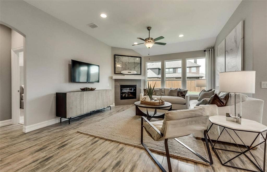 2816 southampton Drive, McKinney, TX 75071 Wood-finish flooring, recessed lighting, and a corner fireplace with a mantel