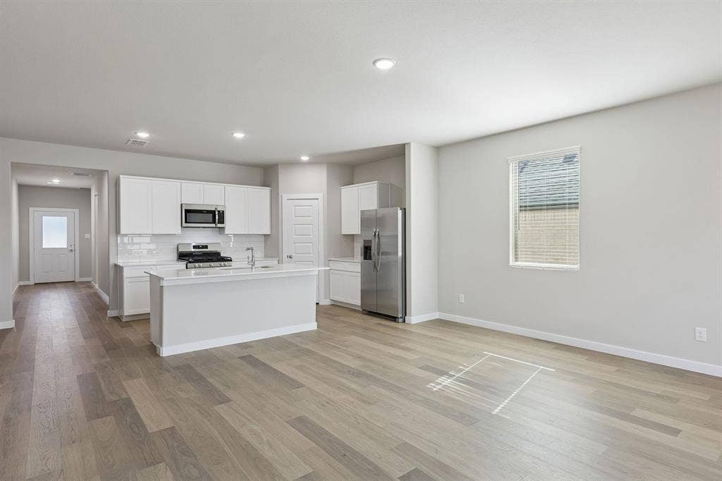 Kitchen and Dining Room in the Holden home plan – REPRESENTATIVE PHOTO