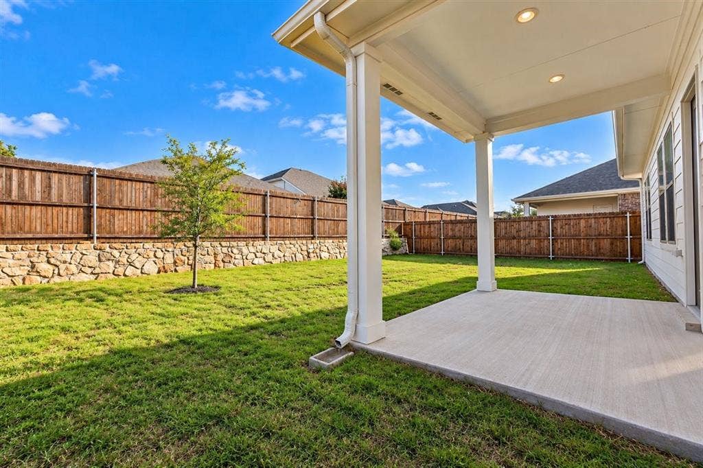 Covered patio with recessed lighting, concrete flooring, and support columns