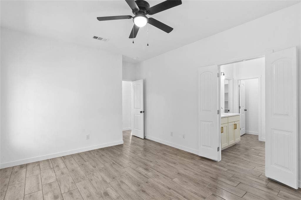 7520 Double Bridge Road, Mabank, TX 75156 Spacious room with wood-finish flooring and a ceiling fan