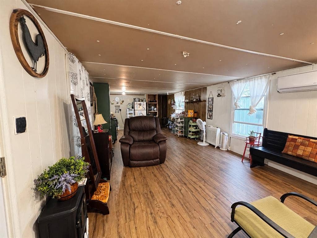 632 Cumberland Trail, Valley View, TX 76272 Wood-finish flooring throughout, white vertical paneling, and an exposed ceiling beam