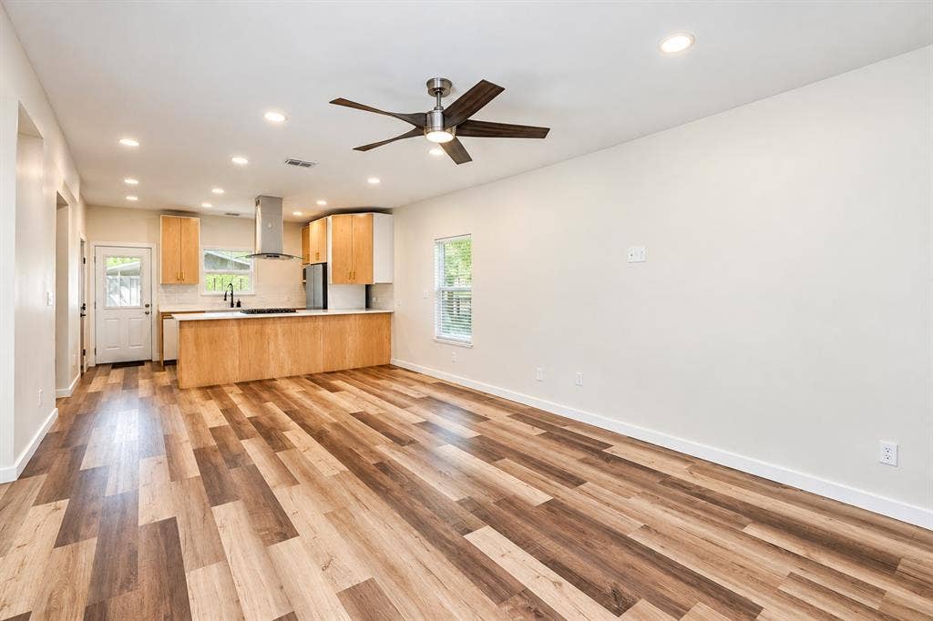 521 York Street, Athens, TX 75751 Open-concept living area with wood-finish flooring, recessed lighting, and a ceiling fan