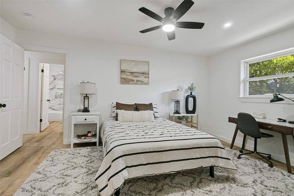 2704 Parkhaven Drive, Plano, TX 75075 Recessed lighting, a ceiling fan with integrated lighting, wood-finish flooring, and white interior doors with black hardware
