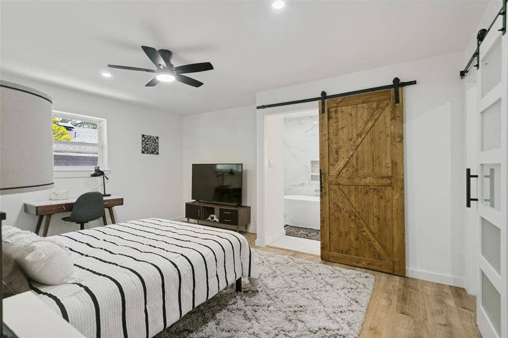 2704 Parkhaven Drive, Plano, TX 75075 Recessed lighting, wood-finish flooring, and a contemporary ceiling fan