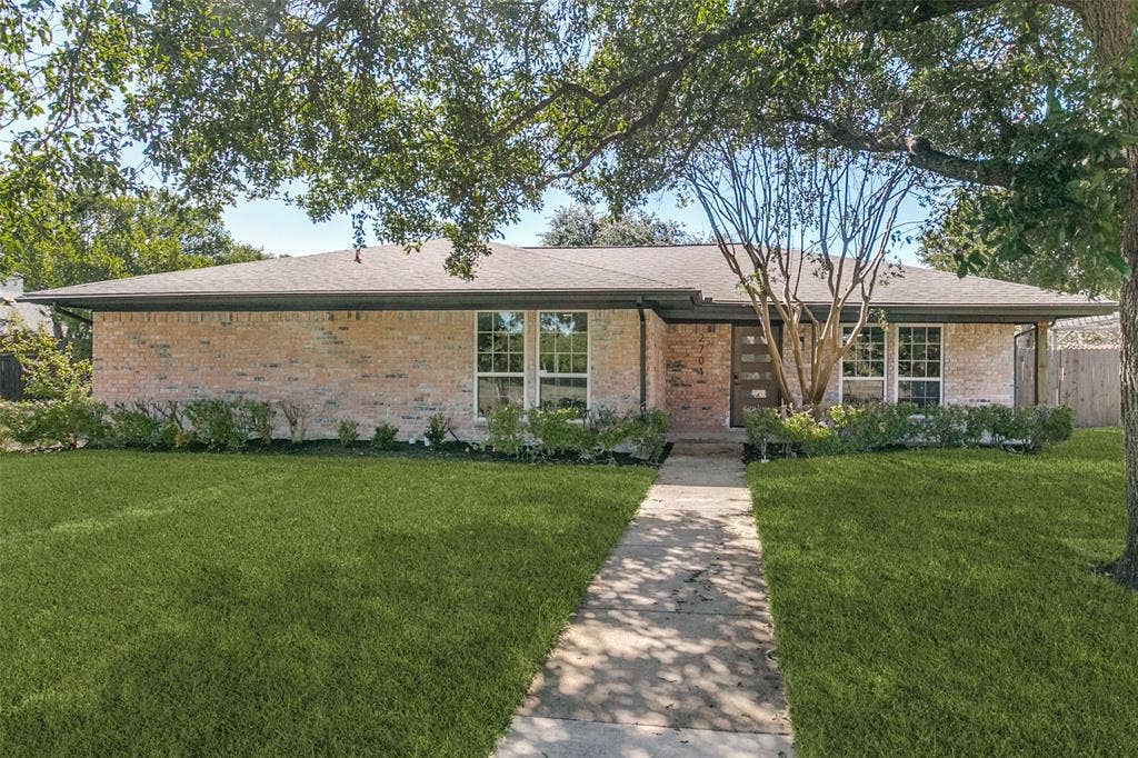 2704 Parkhaven Drive, Plano, TX 75075 Brick exterior with a gabled roof
