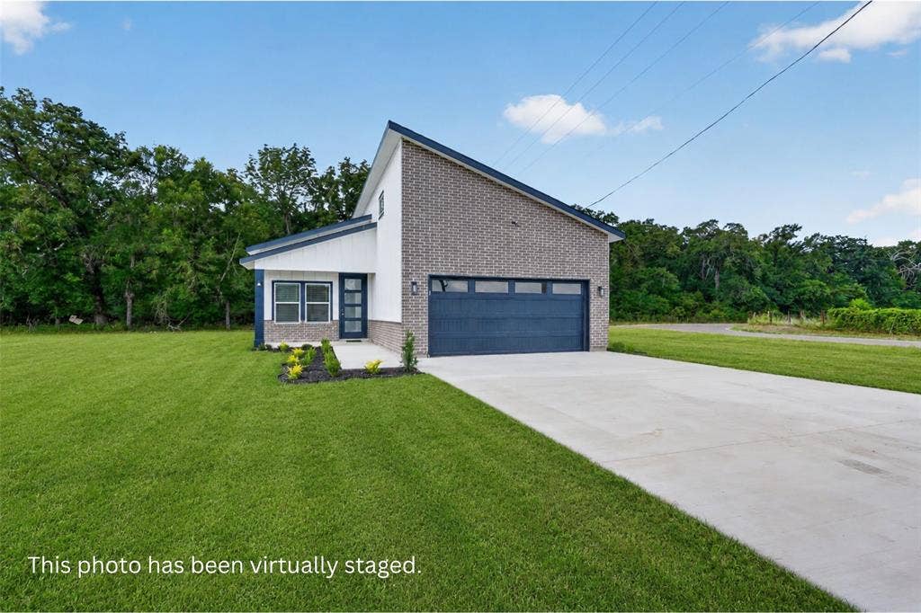 102 Shadywood Road, Trinidad, TX 75163 Contemporary exterior with a prominent brick facade and a contrasting white siding