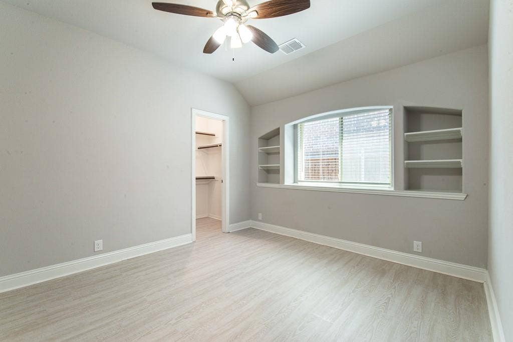 Wood-finish flooring with crisp white baseboards