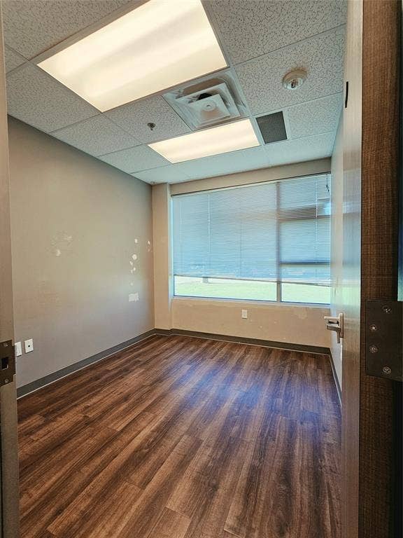 1675 Republic Parkway, #104, Mesquite, TX 75150 Wood-finish flooring, drop ceiling with integrated lighting, and window with blinds