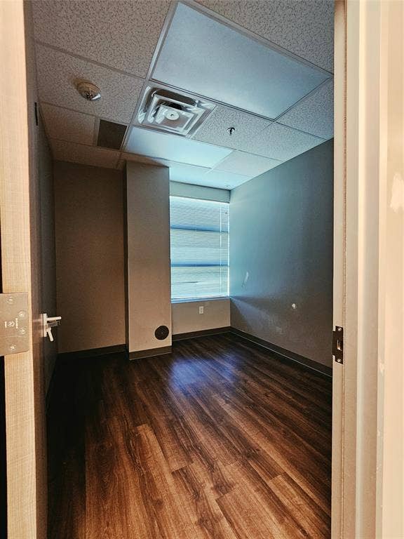 1675 Republic Parkway, #104, Mesquite, TX 75150 Wood-finish flooring, drop ceiling with integrated lighting, and a window with horizontal blinds