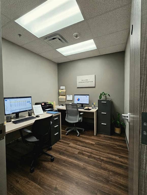 1675 Republic Parkway, #104, Mesquite, TX 75150 Recessed fluorescent lighting, wood-finish flooring, and light gray wall paint