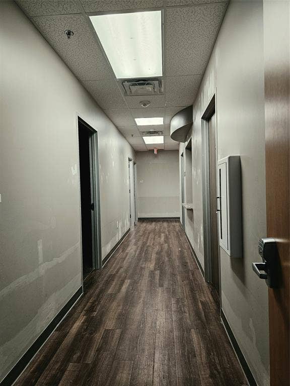 1675 Republic Parkway, #104, Mesquite, TX 75150 Wood-finish flooring, drop ceiling with recessed lighting, and neutral wall tones