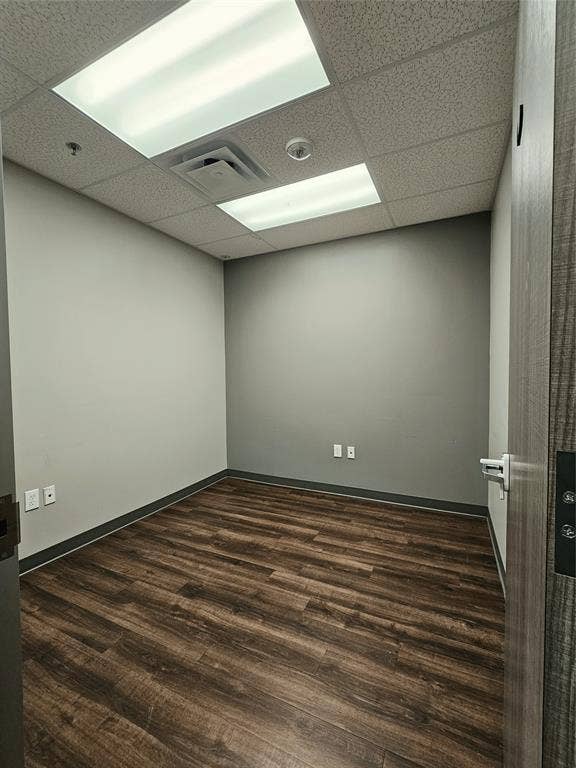 1675 Republic Parkway, #104, Mesquite, TX 75150 Recessed lighting with a drop ceiling, wood-finish flooring, and neutral wall tones
