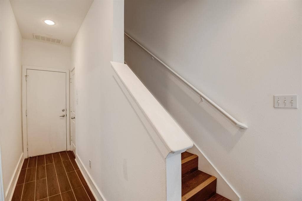 Stairway featuring recessed lighting and baseboards