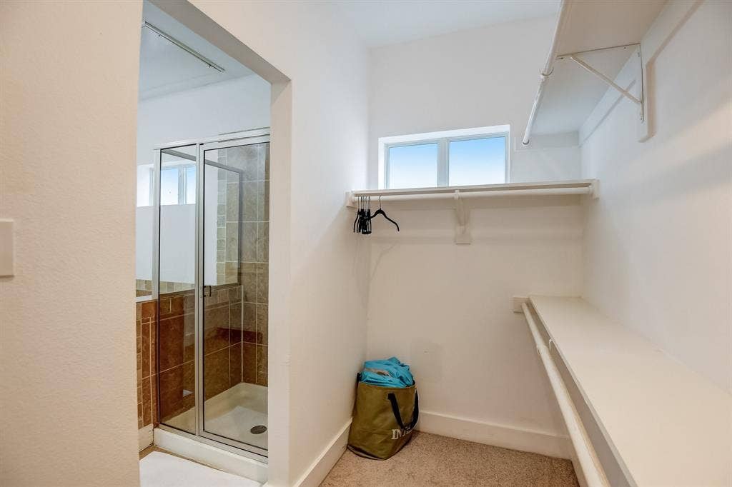 Spacious closet featuring carpet floors