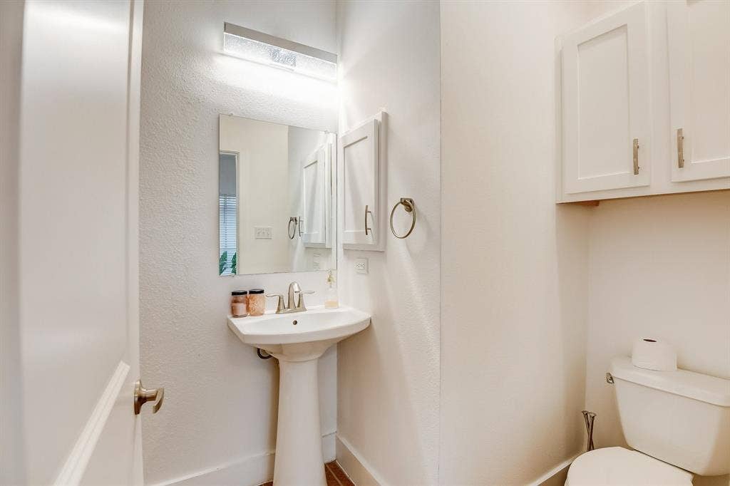 Half bath with toilet and a sink