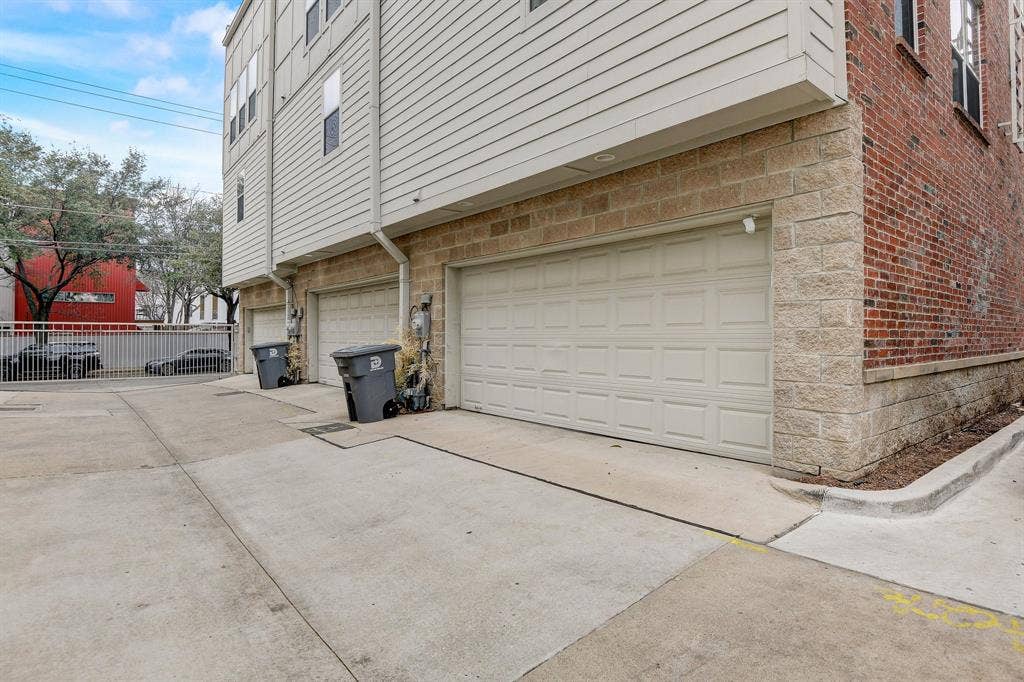 Garage featuring driveway