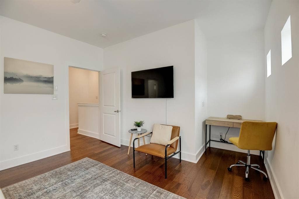 Office space featuring wood finished floors and baseboards