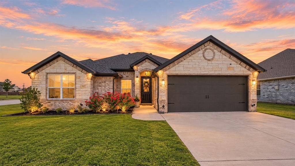 601 Violet Drive, Tolar, TX 76476 Stone veneer exterior with dark trim and a gabled roof