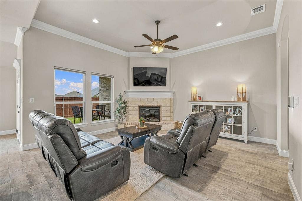 601 Violet Drive, Tolar, TX 76476 Vaulted ceiling with crown molding, ceiling fan, and recessed lighting