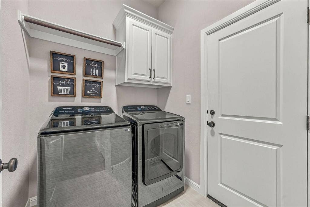 601 Violet Drive, Tolar, TX 76476 White shaker-style cabinetry, recessed panel door, and a built-in hanging rod