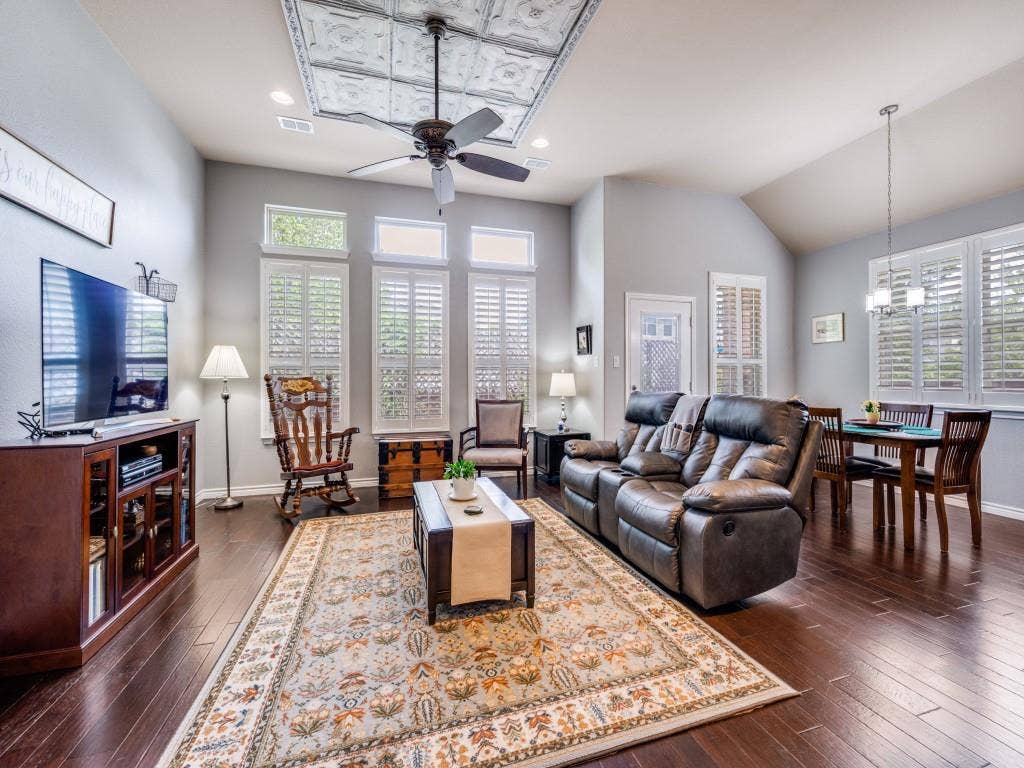 1220 Isabella Lane, Savannah, TX 76227 Gorgeous wood floors and abundant natural light create a warm, inviting living space.