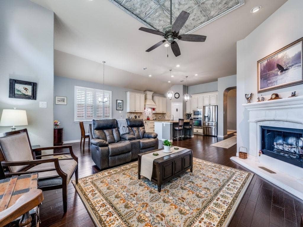 1220 Isabella Lane, Savannah, TX 76227 The open layout keeps the kitchen and living spaces connected for easy entertaining
