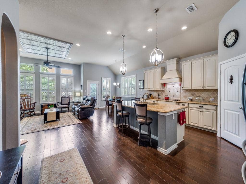 1220 Isabella Lane, Savannah, TX 76227 Elegant plantation shutters and upgraded lighting add timeless style throughout.