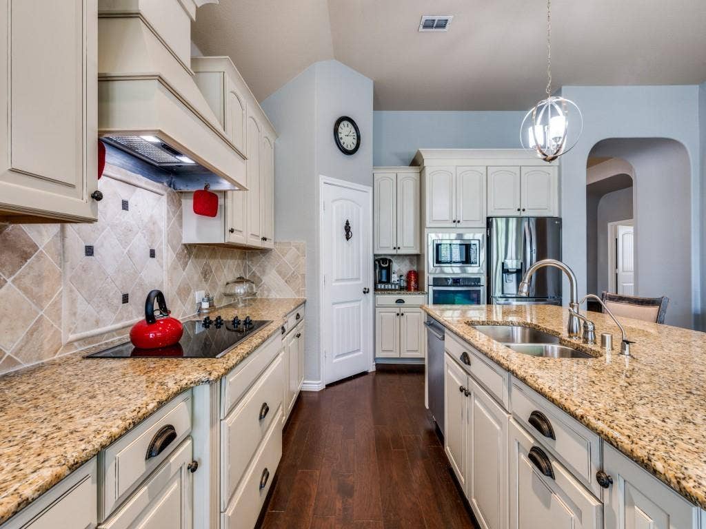1220 Isabella Lane, Savannah, TX 76227 The kitchen offers a functional layout with ample workspace, generous cabinetry, and an easy flow for everyday living