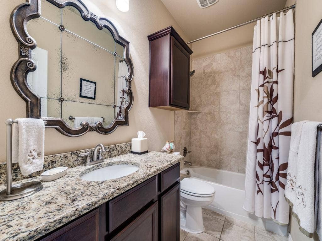 1220 Isabella Lane, Savannah, TX 76227 A well-appointed guest bath offers comfort and convenience for family and visitors alike.
