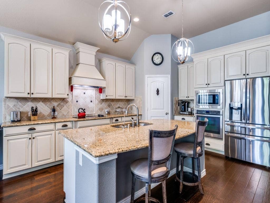 1220 Isabella Lane, Savannah, TX 76227 The kitchen offers a functional layout with ample workspace, generous cabinetry, and an easy flow for everyday living